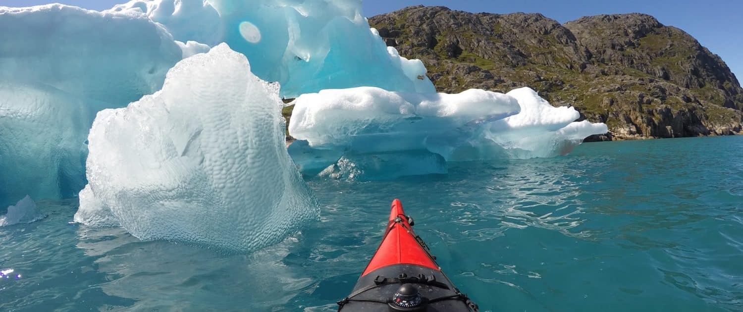 Kayak at Ice. By Visit Greenland