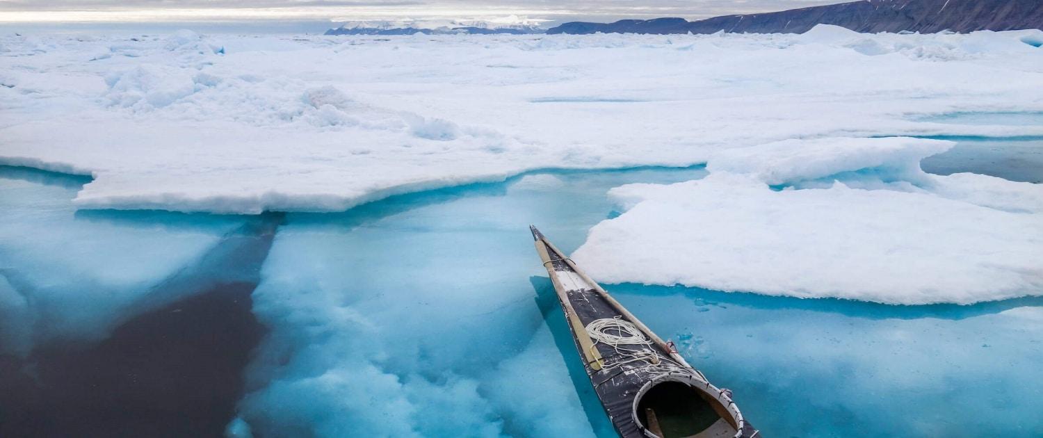 Empty kayak waiting by the pack ice in Qaanaaq - Photo by Kim Insuk, Visit Greenland