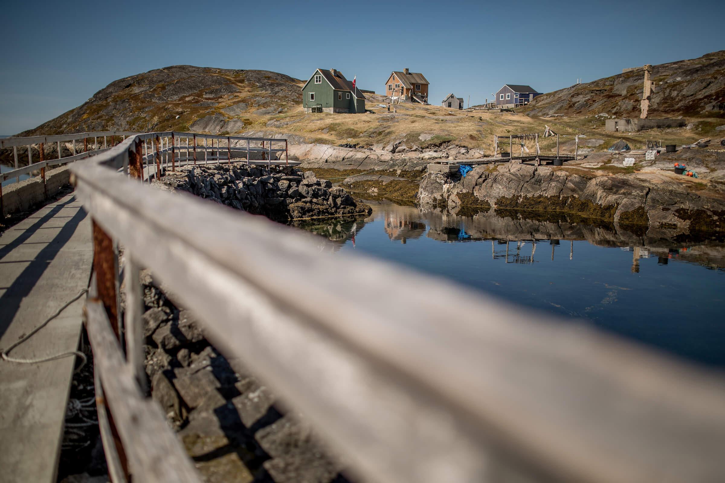 An old bridge in the abandoned village Kangeq near Nuuk in Greenland where some houses are now private holiday homes
