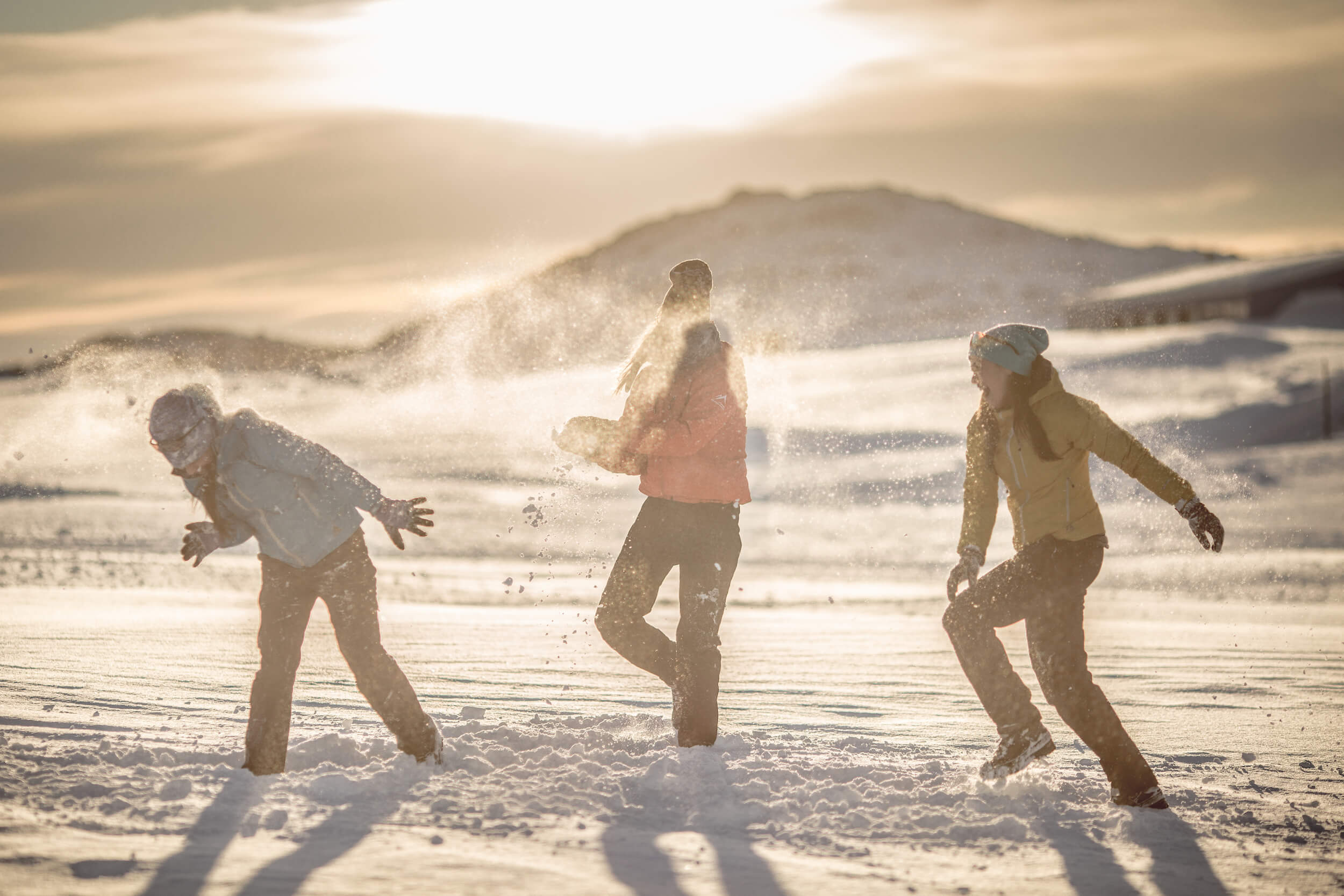 A sunset snowball fight in Kulusuk in East Greenland. Photo by Mads Pihl