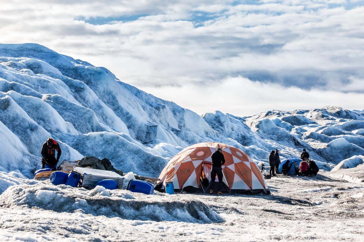Adventurers settling in at Camp Ice Cap on the Greenland Ice Sheet, run by Albatros Arctic Circle in Kangerlussuaq. By Raven Eye Photography