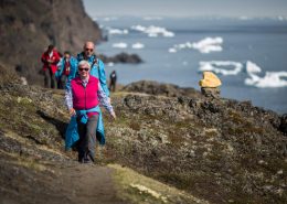 Cruise guests from MS Fram on a hike to the basaltic rocks in Qeqertarsuaq