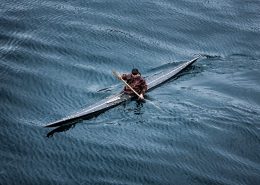 History - A kayaker from Sisimiut in Greenland in a traditional skin kayak