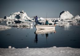 Hunting Culture - Two hunters in the sea ice near Tasiilaq in East Greenland