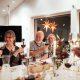 Locals and tourists toasting at a christmas dinner in Nuuk in Greenland. Photo by Rebecca Gustafsson