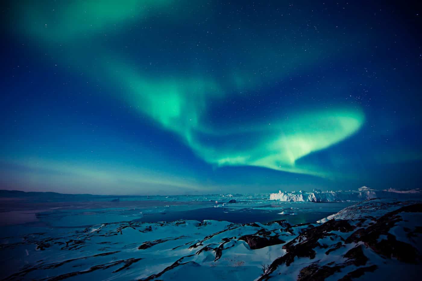 Northern lights over the Ilulissat Icefjord. Photo by Andre Schoenherr