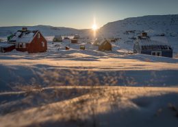 Sunrise over the village Oqaatsut in North Greenland near Ilulissat in the Disko Bay