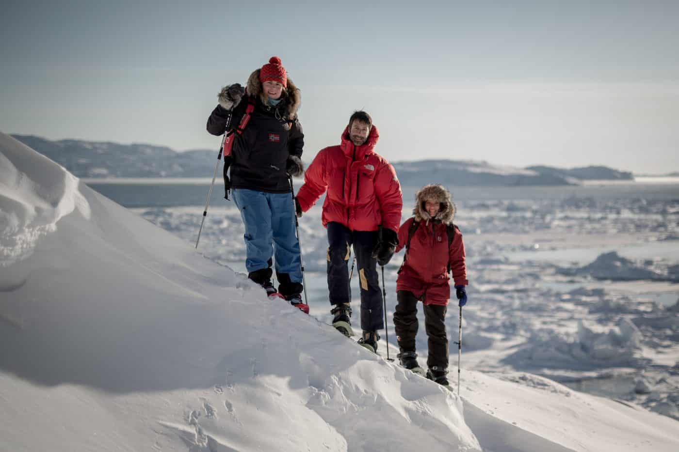 Three snowshoers on a PGI Greenland snowshoe trip near Ilulissat in Greenland. By Mads Pihl
