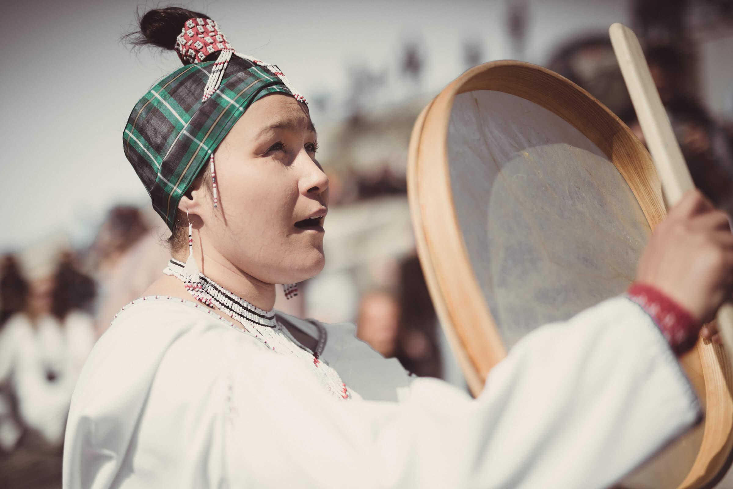 Traditional Dress - A drum dancer performing in Nuuk on National Day in Greenland