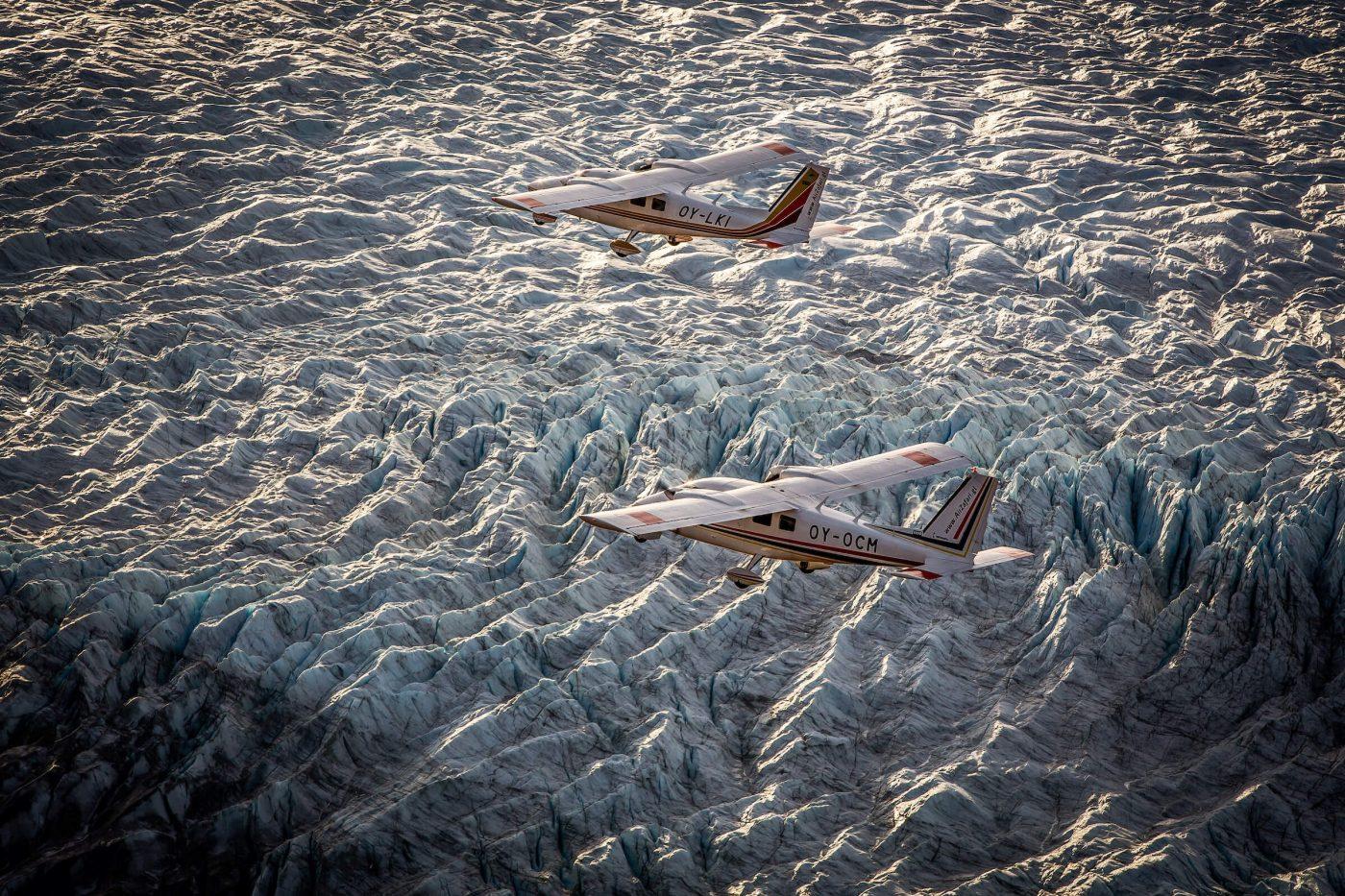 Two Air Zafari flightseeing planes over the Greenland Ice Sheet near Kangerlussuaq Airport. By Mads Pihl
