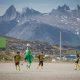 A game of soccer in Nanortalik in South Greenland with a backdrop of rugged peaks. Photo by Mads Pihl, Visit Greenland