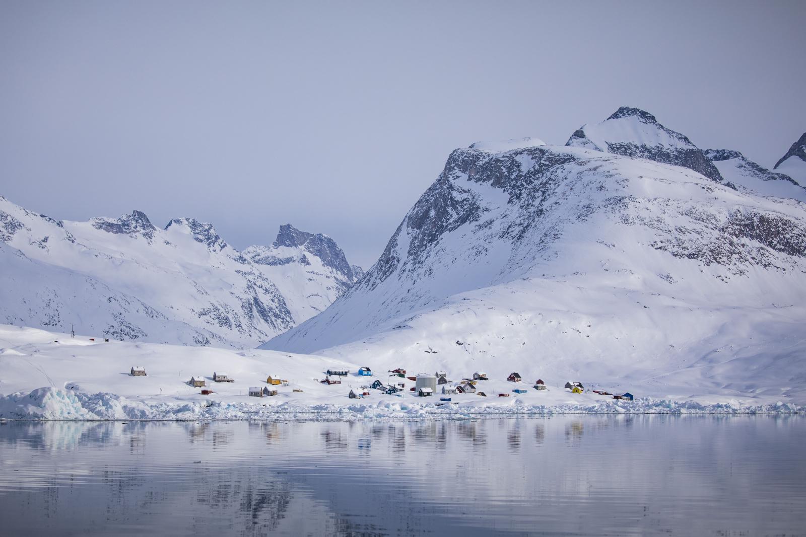 The settlement Tiilerilaaq between towering mountains in winter. Photo by Aningaaq Rosing Carlsen - Visit Greenland