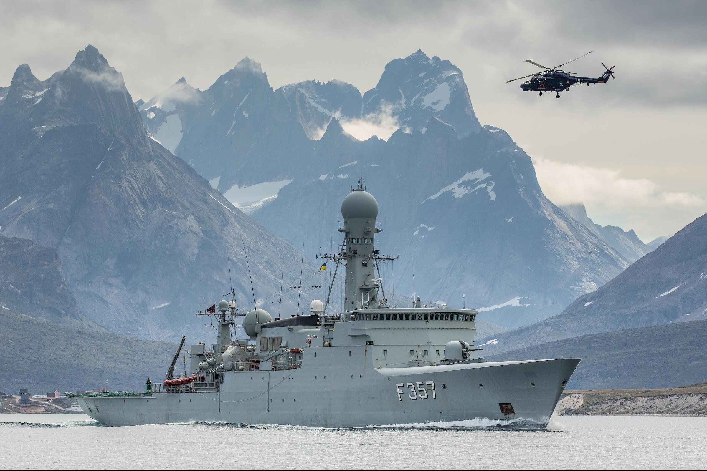 HDMS Thetis and a lynx helicopter from the Danish navy in the Tasermiut fjord in South Greenland. Photo by Mads Pihl - Visit Greenland