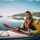 Smiling man on kayak. Photo - Jorgo Kokkinidis, Visit Greenland