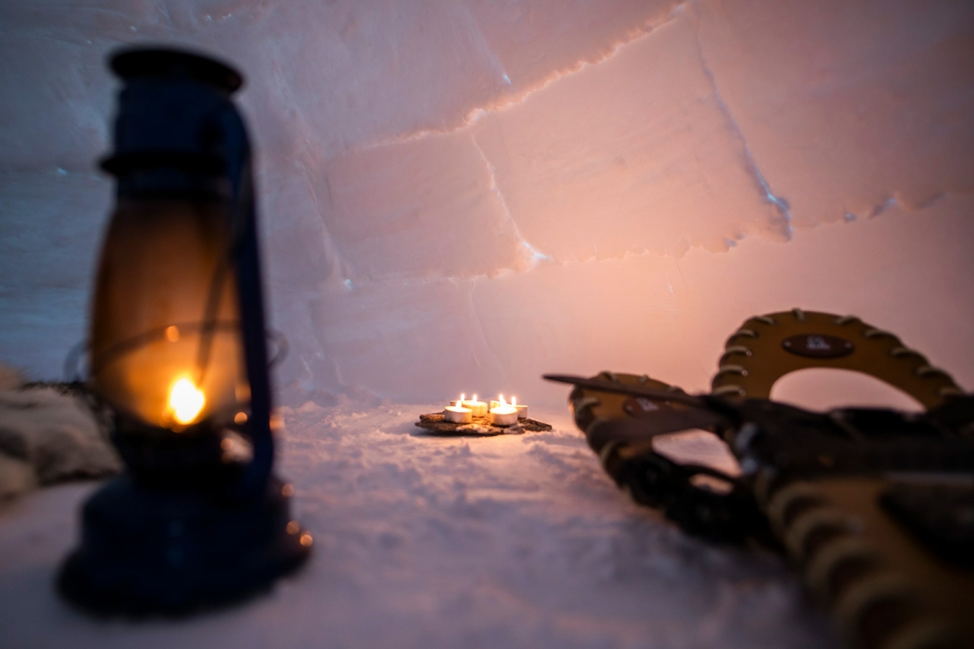 Candles lit in an igloo. Photo - Aningaaq R. Carlsen, Visit Greenland