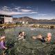 A family enjoying the Uunartoq hot springs in South Greenland. By Mads Pihl
