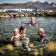 A family visiting Uunartoq Springs in South Greenland