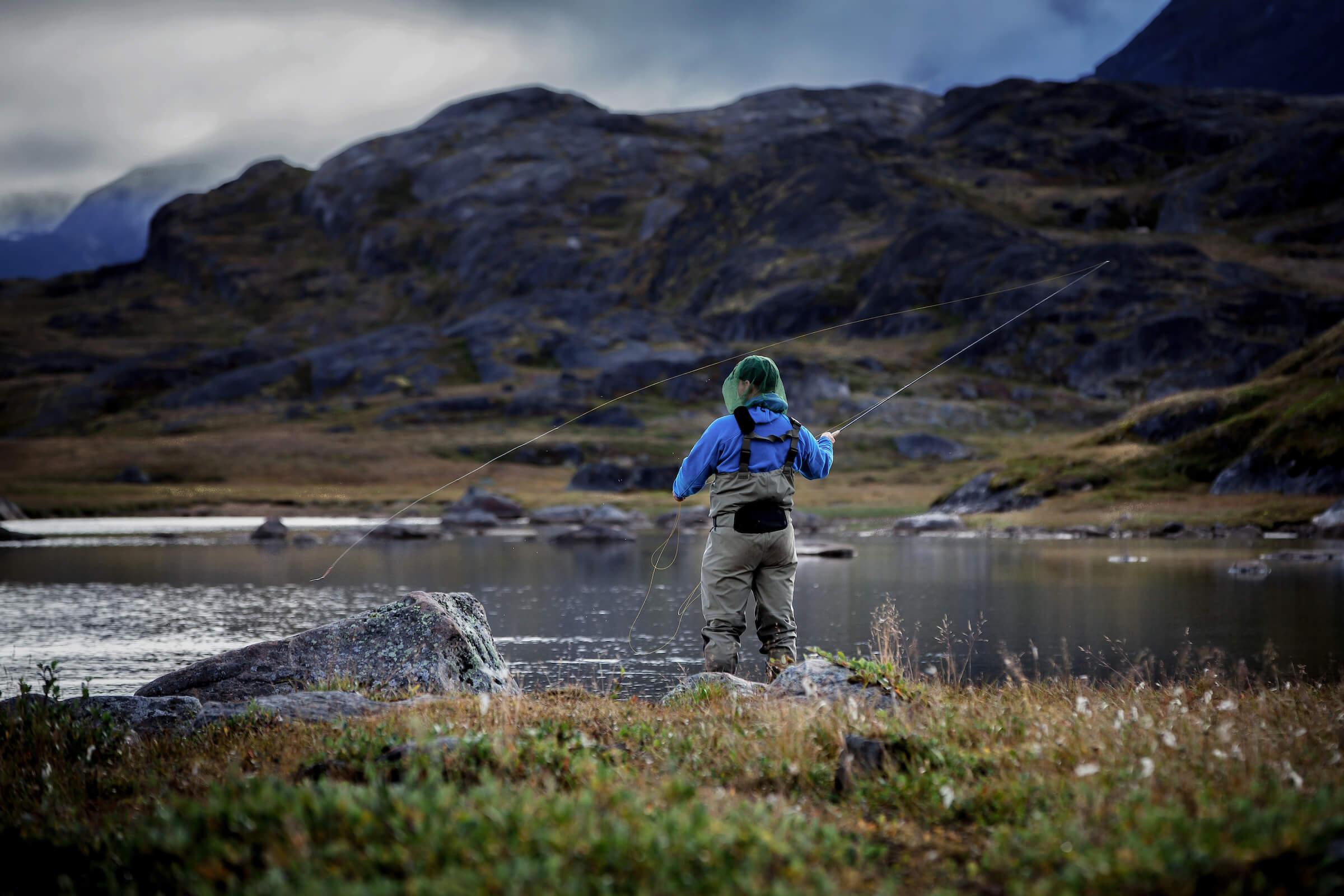 Fly fishing on Erfalik river in Destination Arctic Circle in West Greenland. By Mads Pihl