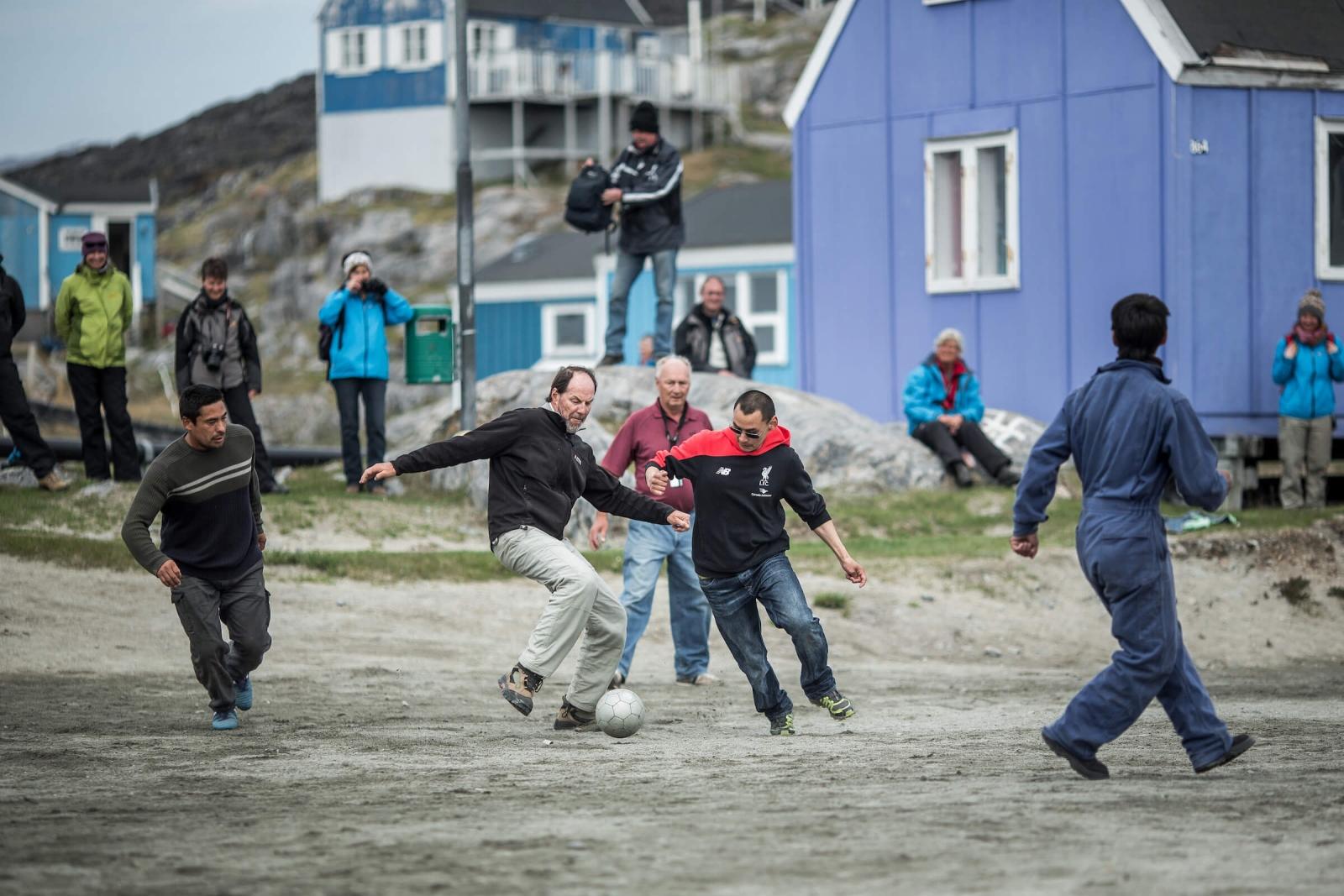 A game of soccer between cruise guests and Itilleq locals in Greenland. Photo by Mads Pihl