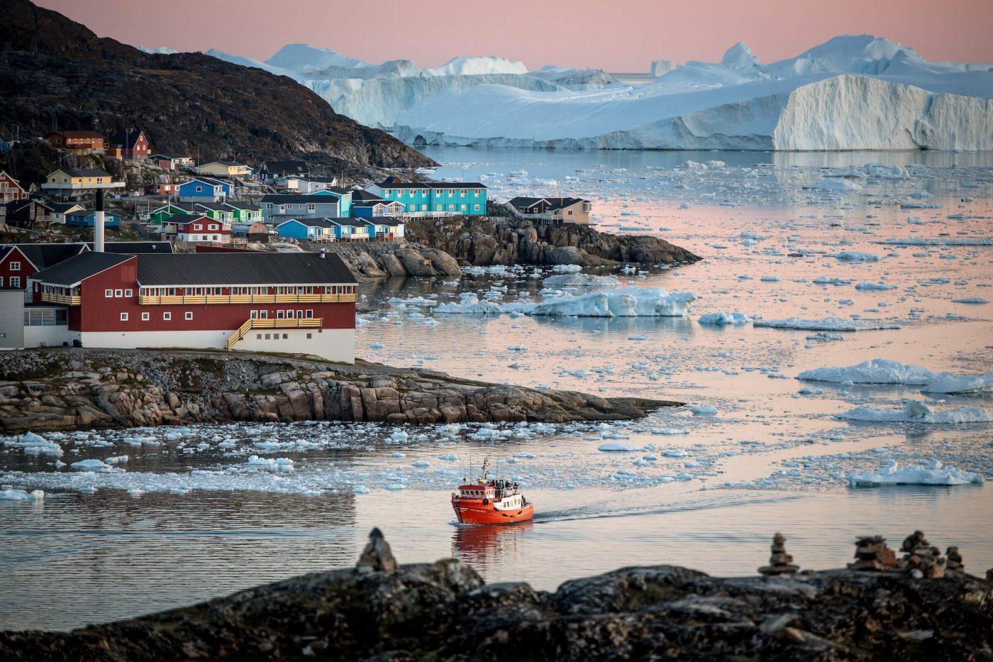 A passenger boat near Ilulissat and the ice fjord in Greenland. By Mads Pihl