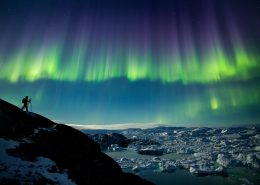 A photographer on a photo tour in North Greenland captures the perfect nighttime shot of northern lights, the starry night sky, and icebergs in the Ilulissat Icefjord. By Paul Zizka