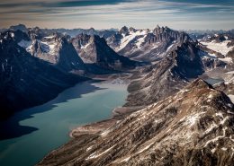 A view over the fjord leading towards the famous triplets peaks and the glacier near tasiilaq mountain hut in east greenland. By Mads Pihl