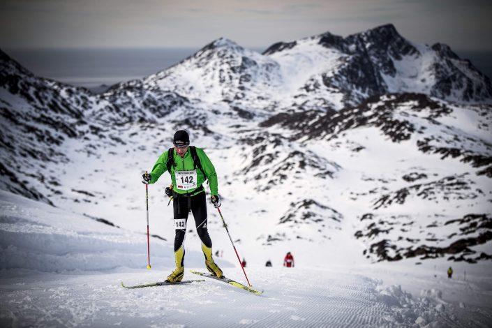 Competitor skiing uphill - Arctic Circle Race. Photo by Mads Pihl, Visit Greenland