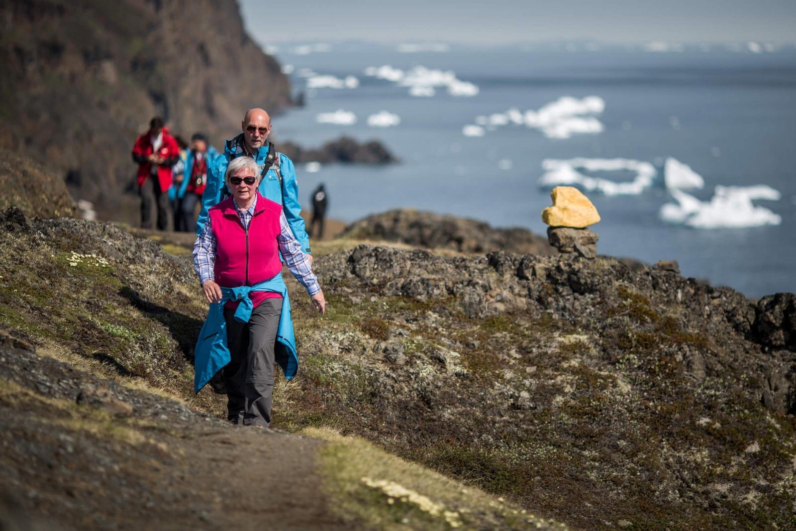 Cruise guests from MS Fram on a hike to the basaltic rocks in Qeqertarsuaq