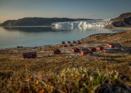 An overview of the Eqi Glacier Lodge camp with the glacier in the background in North Greenland. Photo by Mad Pihl, Visit Greenland