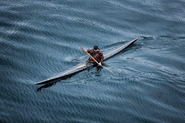 A kayaker from Sisimiut in Greenland in a traditional skin kayak. Photo by Mads Pihl, Visit Greenland
