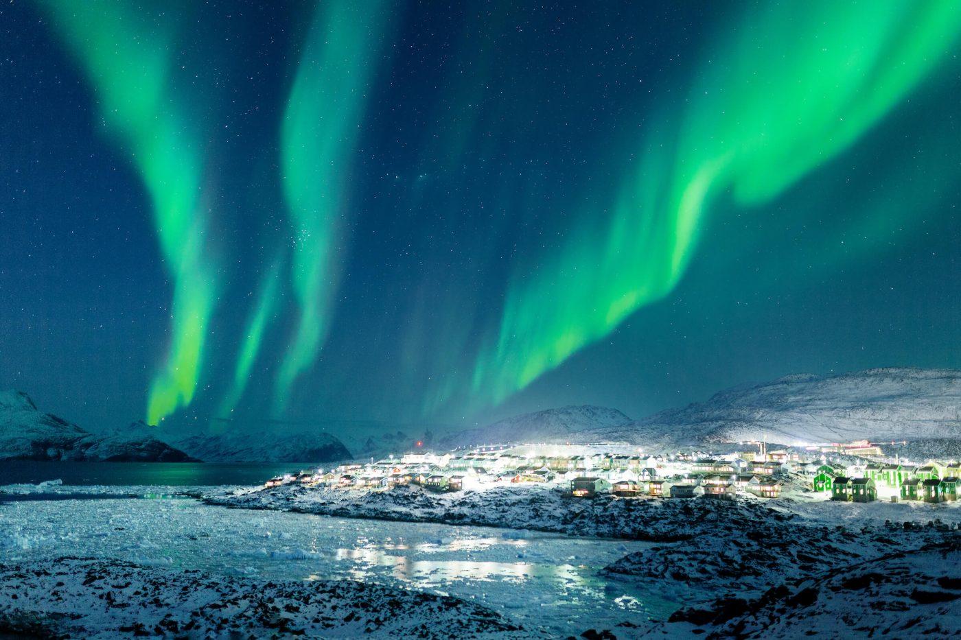 Northern Lights over the city lights of Nussuaq, Nuuk in Greenland. Photo by Rebecca Gustafsson