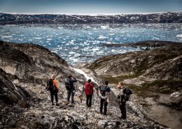 Hikers overlooking Sermilik Ice Fjord in East Greenland. By Mads Pihl
