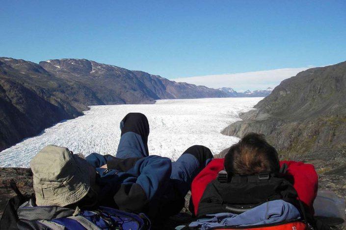 Two hikers looking over a fjord in South Greenland. Photo by Tasermiut South Greenland Expeditions, Visit Greenland