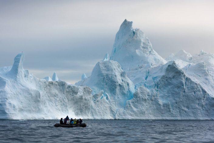 I photographed this group of photographers in the Disko Bay one early morning. I still think they were pushing the limits a little bit with regards to how close to the edge of ice they seem to be, but I'm guessing the captain was in 100% control. By Stian Klo
