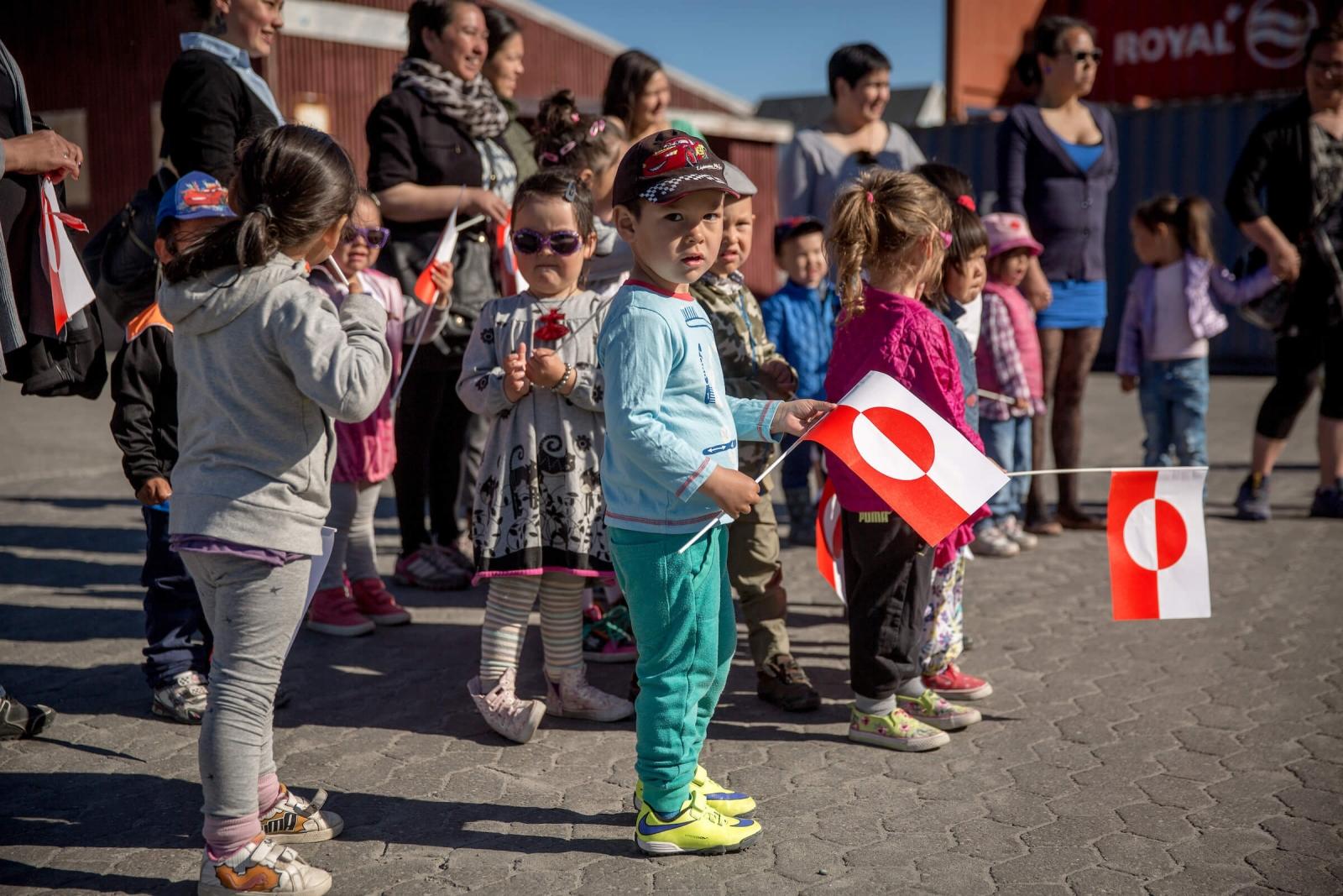 Kindergarden kids welcoming guests in Qasigiannguit in Greenland, by Mads Pihl