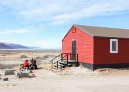 Guests at the Old Camp Hostel enjoying the sun and views in Kangerlussuaq. Photo by Johanna Himstedt