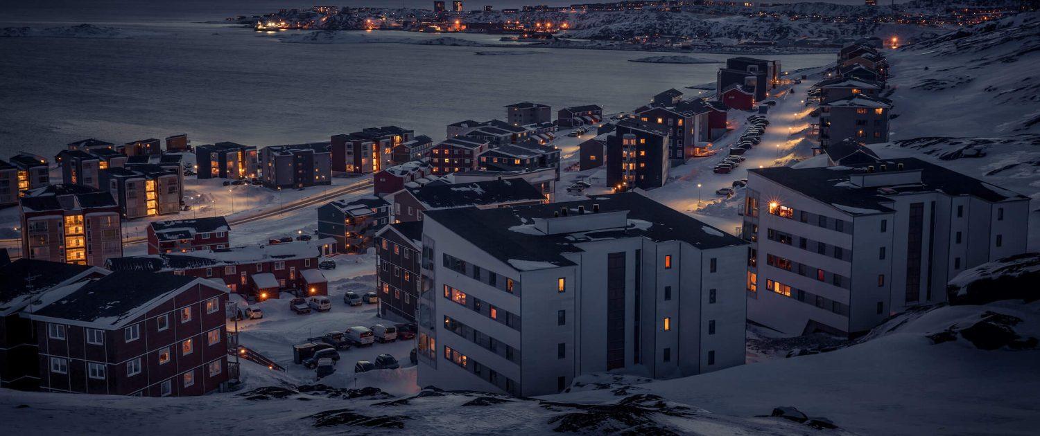 A winter night view from Qinngorput towards Nuuk in Greenland. By Mads Pihl
