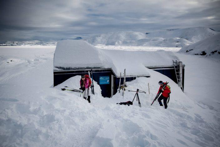 Backcountry skiers preapring fro a day in the landscape around the Travellodge Greenland hut in East Greenland. By Mads Pihl