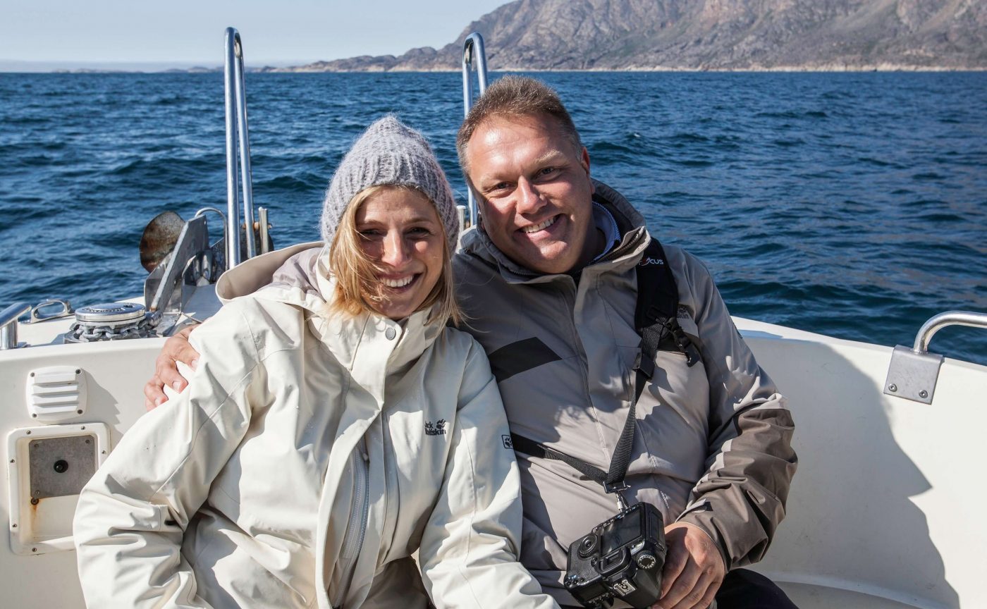 Happy married couple sailing near Sisimiut. Photo by Olafur Rafnar Olafsson
