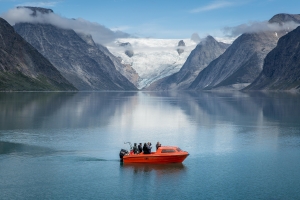 A small passenger boat near the bottom of the Tasermiut fjord in South Greenland