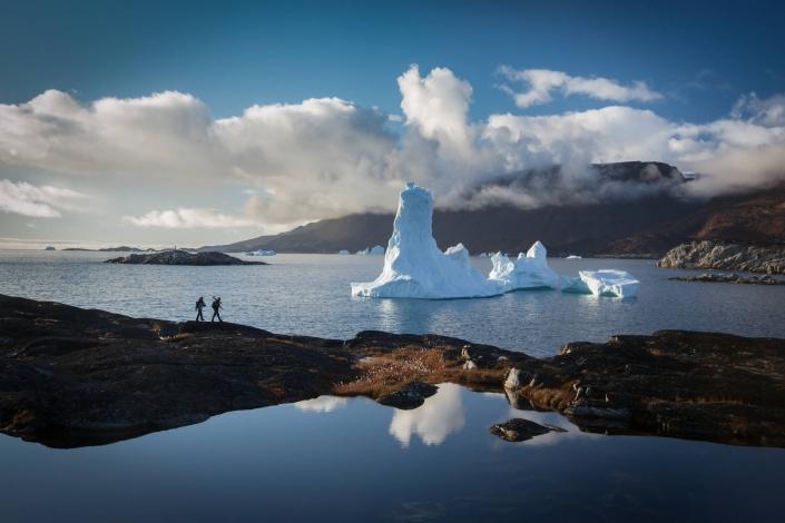 Photographers hiking for the perfect photo stop by the Ilulissat icefjord in North Greenland. Photo by Paul Zizka