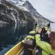Nuuk Water Taxi stopping at a waterfall. Photo by: Aningaaq Rosing Carlsen - Visit Greenland