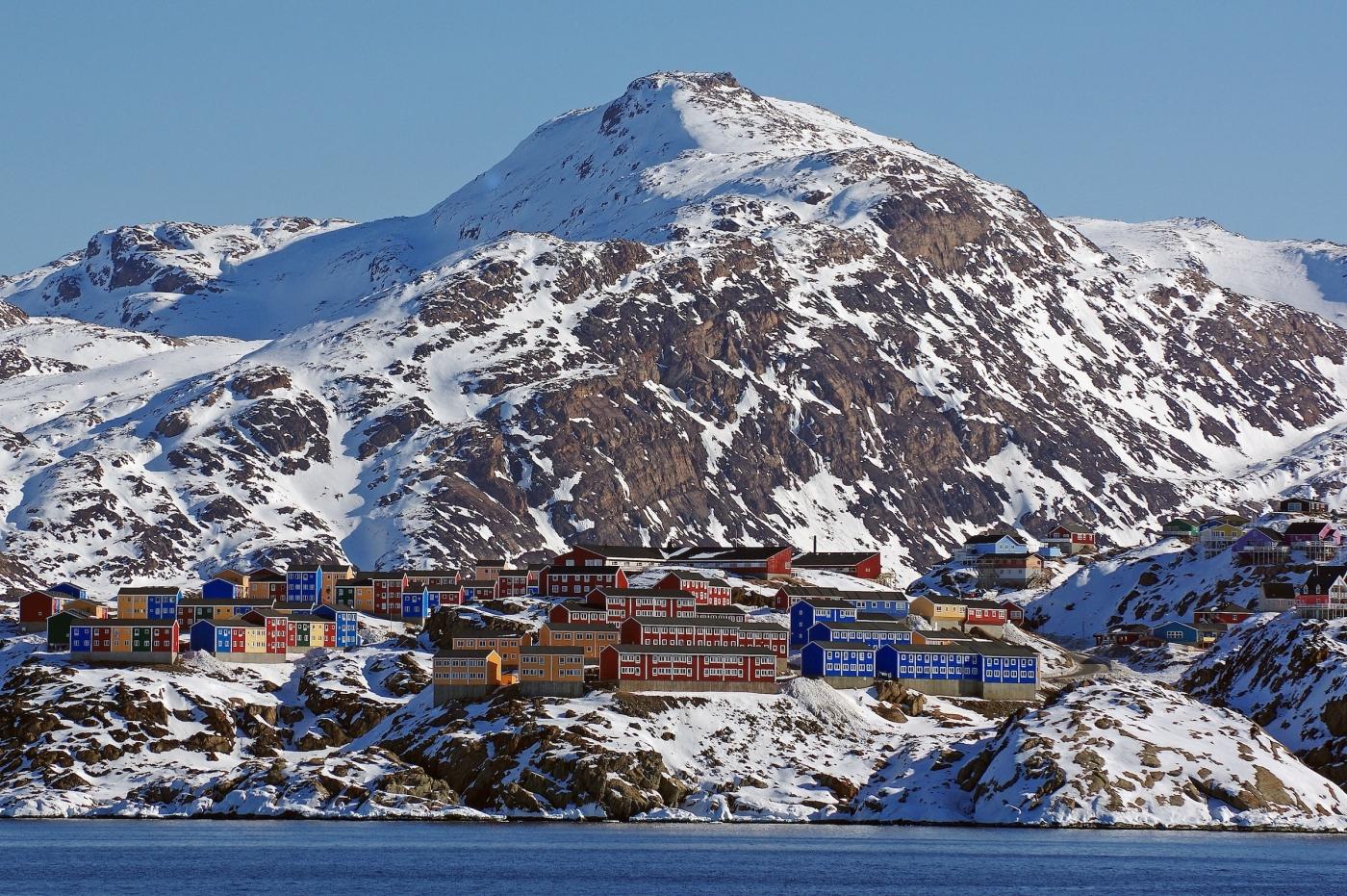 Colourful houses stand out against the winter landscape in Sisimiut, Destination Arctic Circle. Photo by Reinhard Pantke - Visit Greenland.