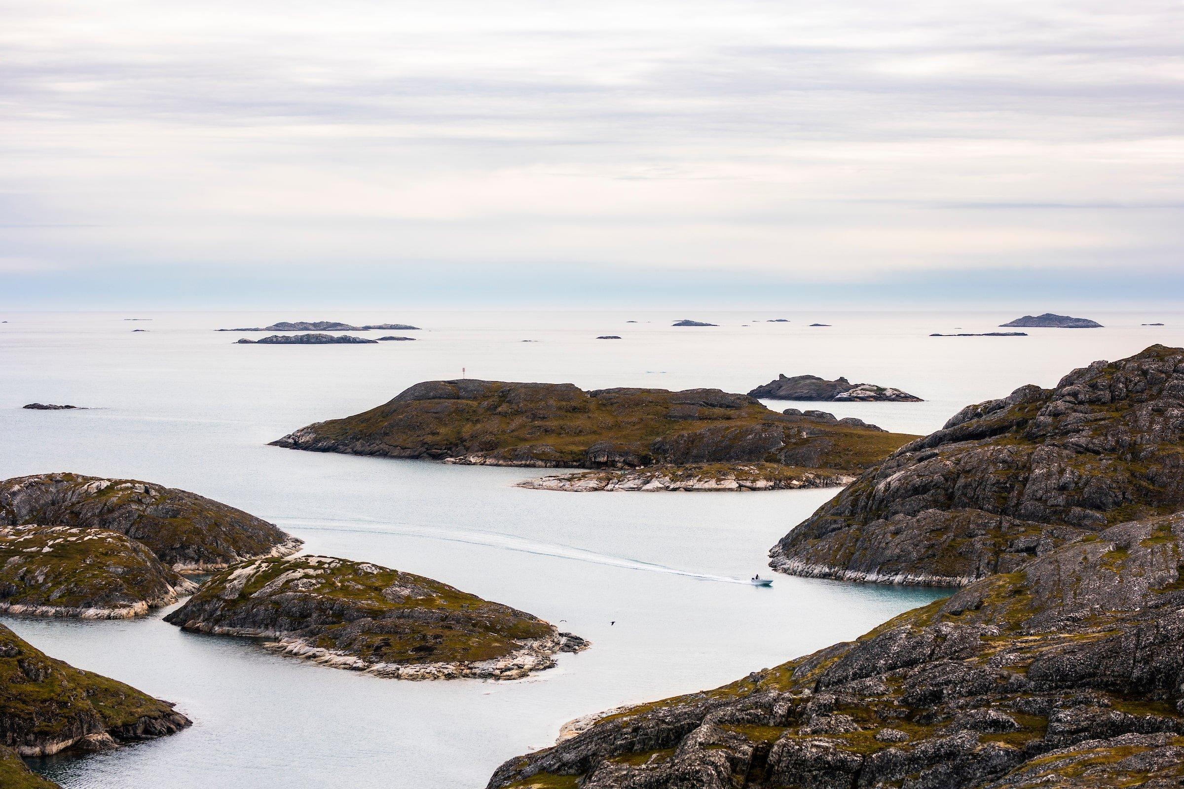 Dinghy sails next to the islands of Paamiut. Photo - Aningaaq R. Carlsen, Visit Greenland