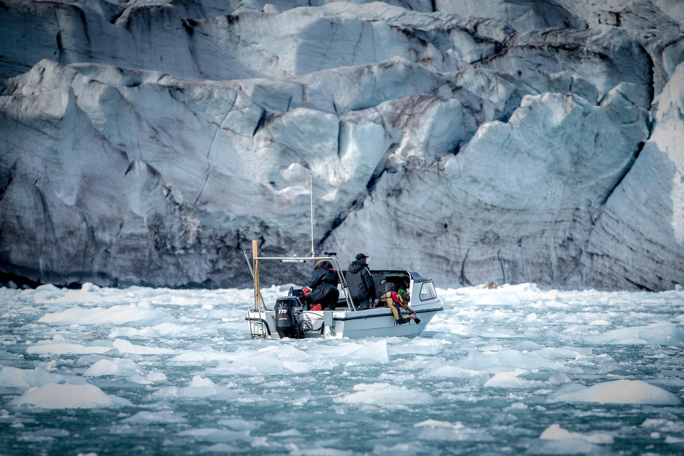 Photographers shooting ice and glaciers near Kulusuk in East Greenland