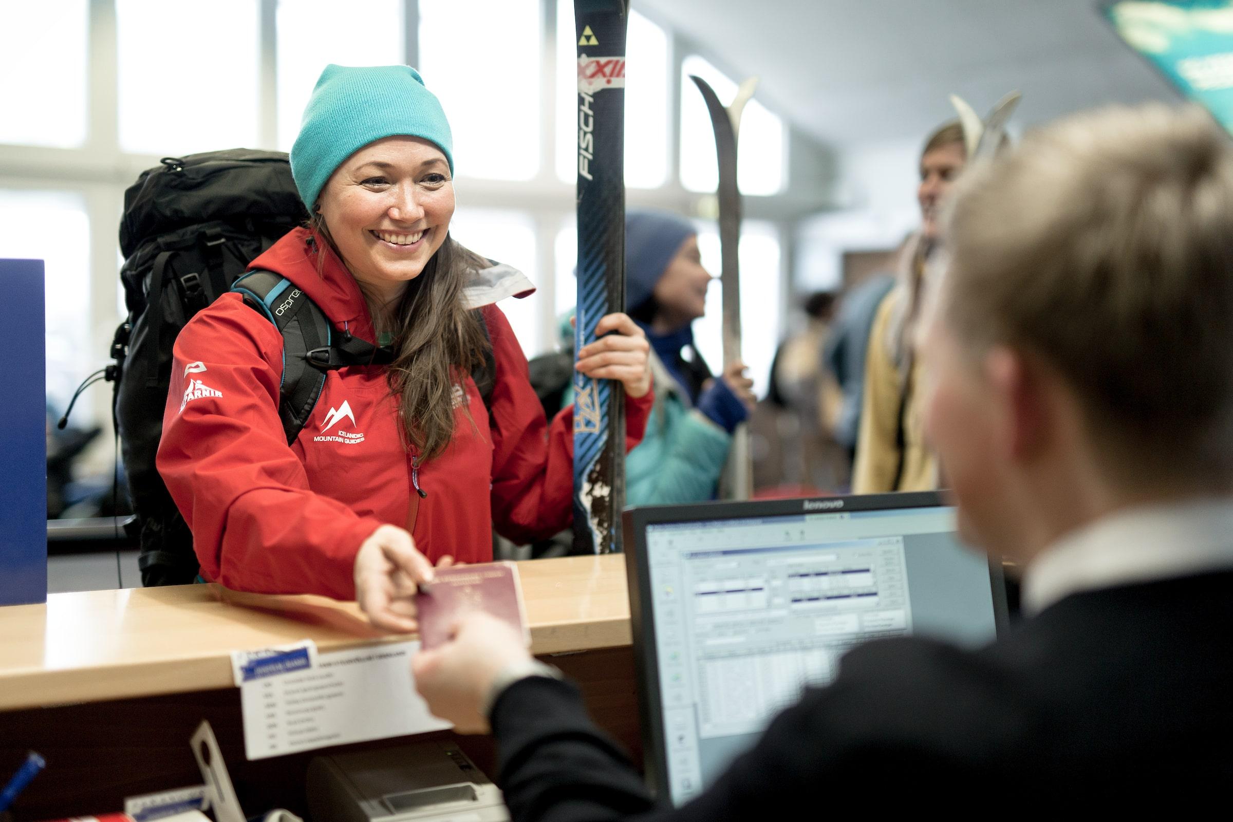 An Icelandic Mountain Guides ski guide checking in at Reykjavik Airport and going to East Greenland. Photo by Mads Pihl