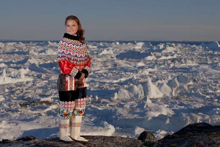 Woman in traditional Inuit Clothing. Photo by Thomas Eltorp, Visit Greenland