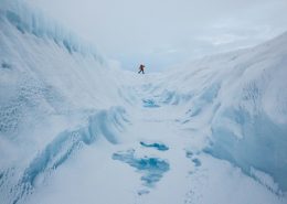 A glacier walking adventure by a crevasse on the Greenland Ice Sheet near Kangerlussuaq. By Paul Zizka