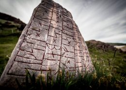 A rune stone on a hill in Qassiarsuk in South Greenland. By Mads Pihl