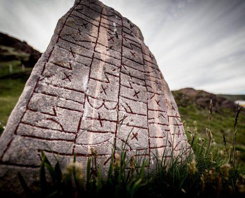 A rune stone on a hill in Qassiarsuk in South Greenland. By Mads Pihl